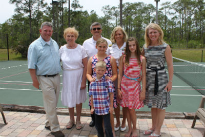 Photo: Kim House celebrates with her family. KimHouse_family_retirement_FORWEb