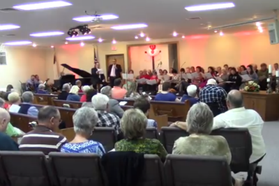 Photo: Pastor Ben and Pastor Brandon leading the congregation.