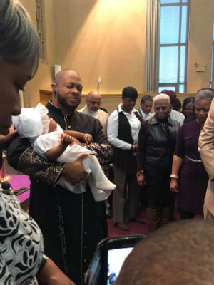 Photo: Pastor Kevin during a baby dedication at church.