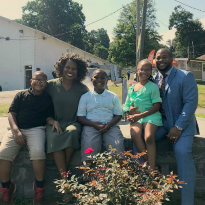 Photo: Pastor Kevin (far right) with his family.