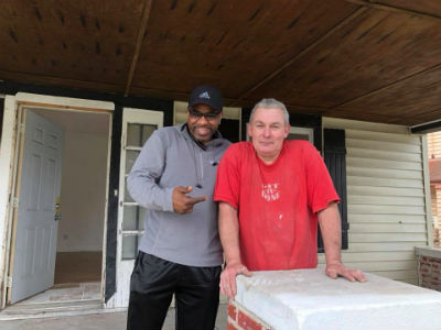 Photo: Handel Smith with Paul, sub-contractor for the church's affordable homes ministry.