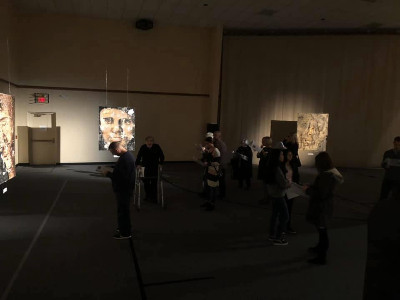 Photo: Participants of the prayer experience walk through the exhibit.