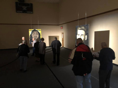 Photo: Participants of the prayer experience walk through the exhibit.